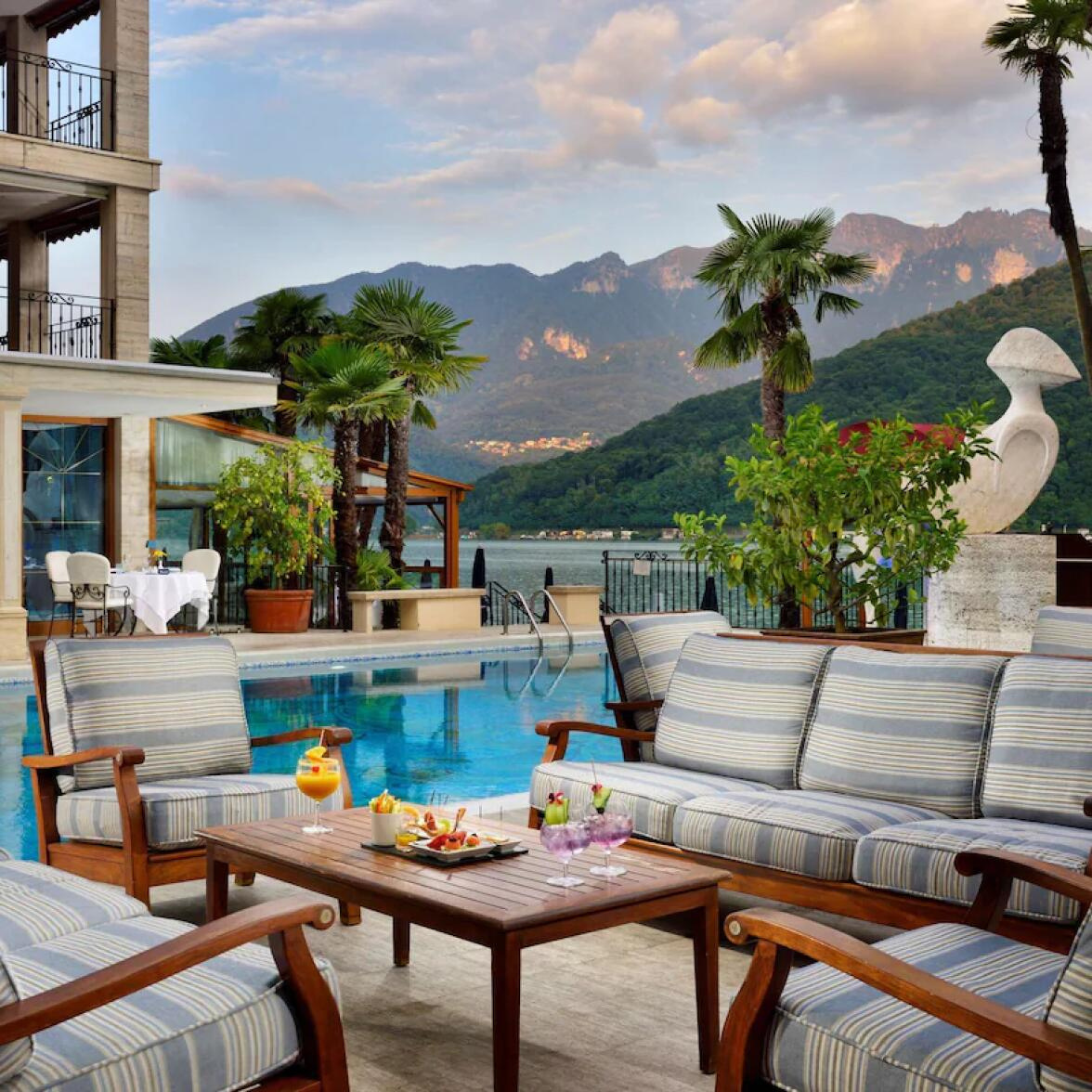 Swiss Diamond Hotel Lugano terrace at dusk over Lake Lugano